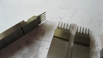 8 pin precision plastic injection mould components made by ShenZhen HUAKAIYU technology Co, Ltd., using Viking or LG steel, hardness 56-60HRC, for high-precision electronic connector manufacturing.