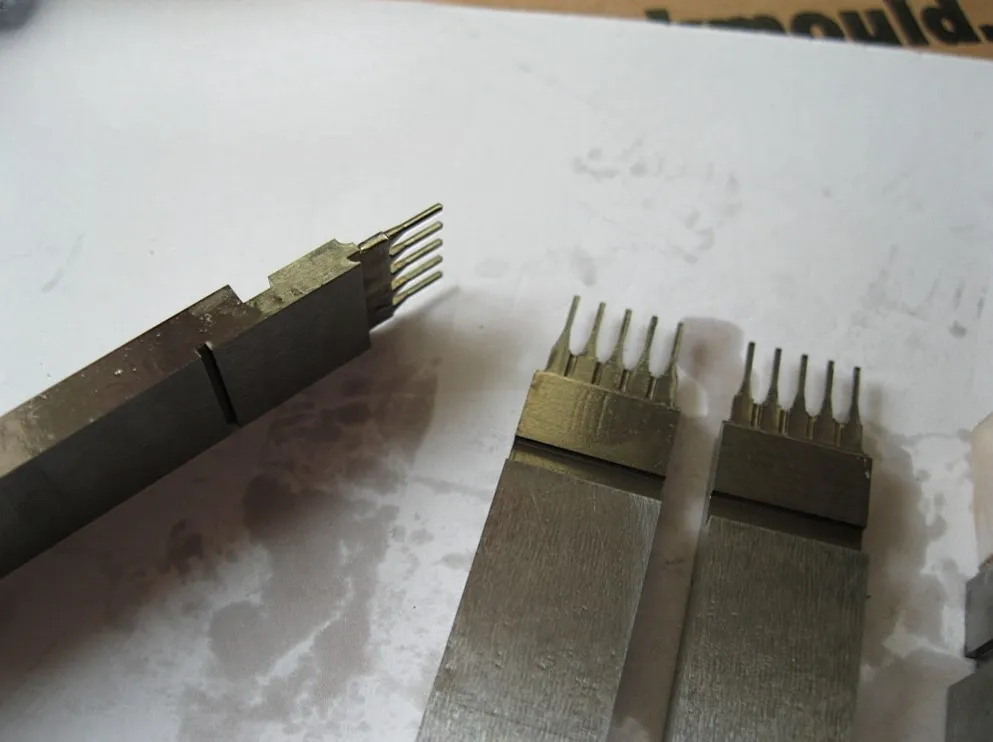8 pin precision plastic injection mould components made by ShenZhen HUAKAIYU technology Co, Ltd., using Viking or LG steel, hardness 56-60HRC, for high-precision electronic connector manufacturing.